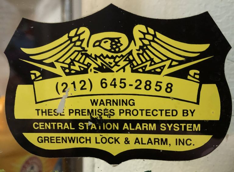 Vintage Greenwich Locksmiths alarm sticker from the 1980s